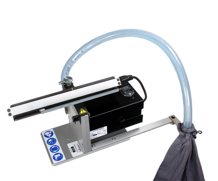 VARGA VA 2 compact edge milling unit with adjustable 4.5 mm bevel depth, 120 mm carbide cutter, anodized aluminum hold-down device, chip extraction system, and 350 W motor for precise chamfering of plastics and non-ferrous metals.