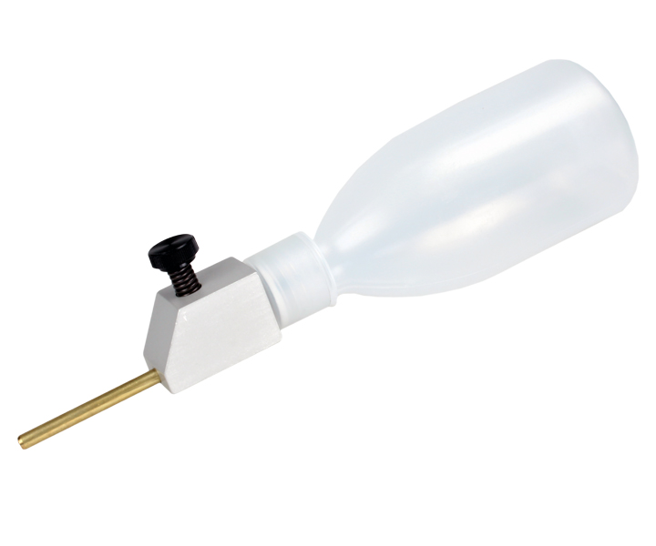 VA 6 drip lubrication system for Varga table saws, with adjustable flow and durable plastic container for precise blade lubrication.